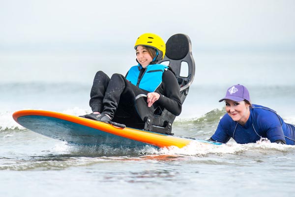7th Wave Surf School Accessible Surfer in the water